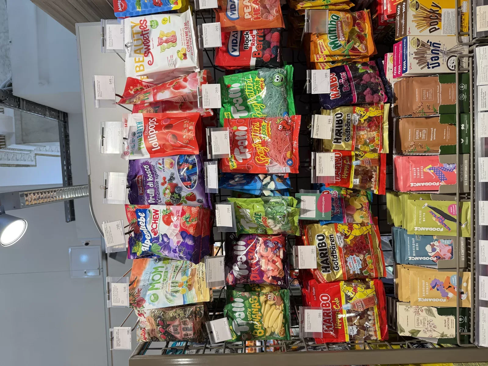Gummy assortment on a CIS retail shelf — sanded formats stand out in open candy walls